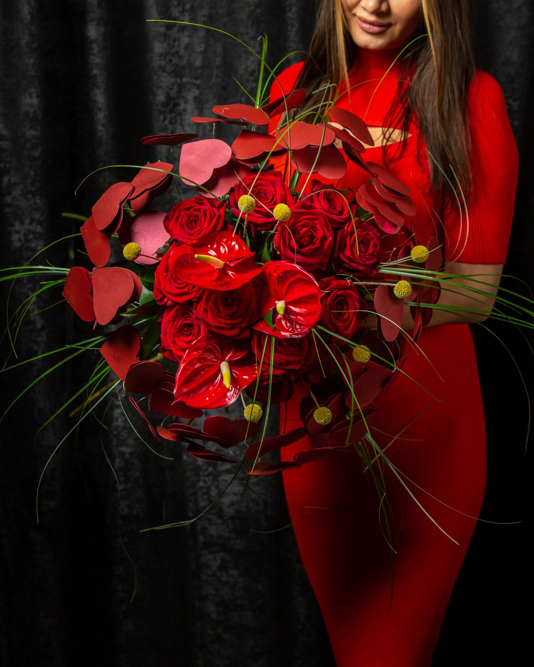 floral decor a woman holding bouquet of anthurium